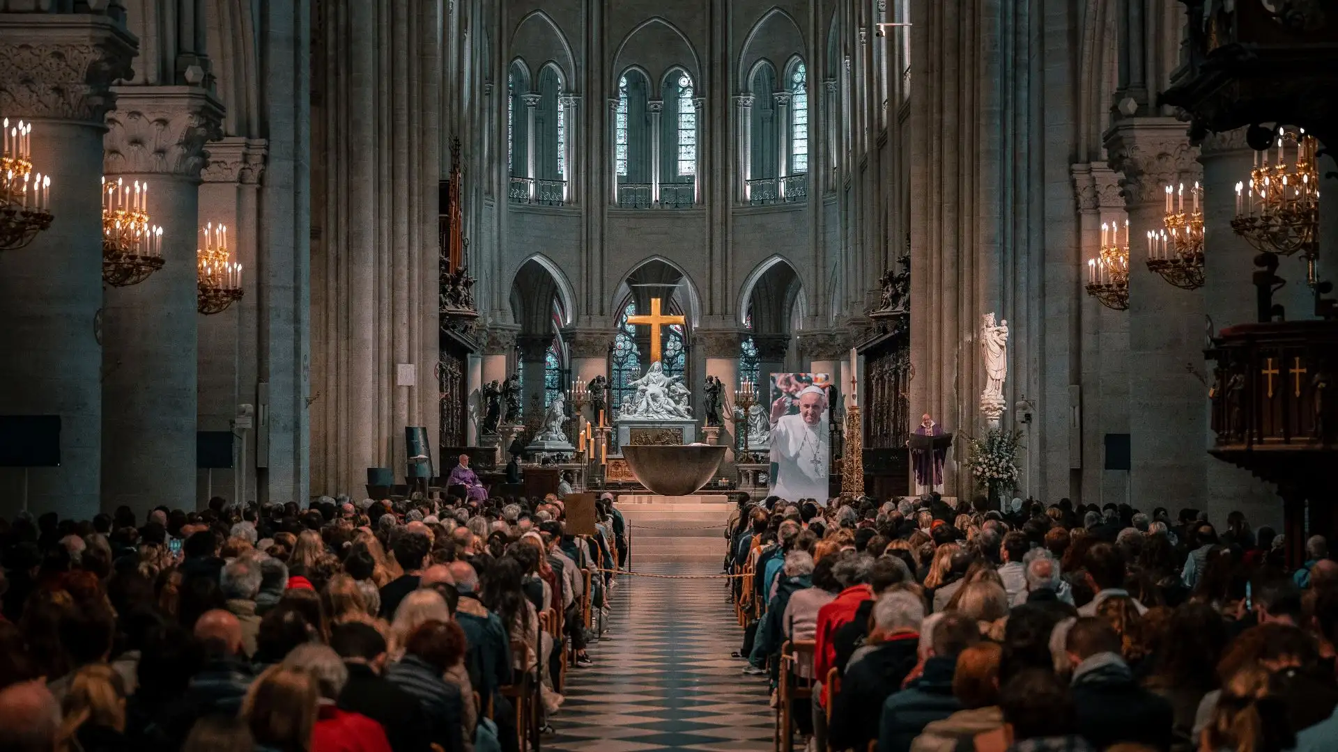 The interior of Notre-Dame Cathedral in Paris during a service of reflection or a requiem mass held in memory of Pope Francis in April 2025
