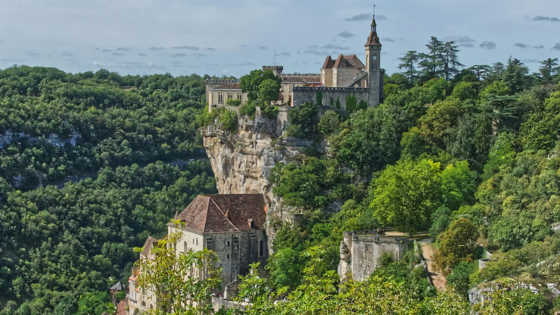 The famous medieval village of Rocamadour, perched spectacularly on a cliffside above the Alzou Valley, in the Lot department (Occitanie region)