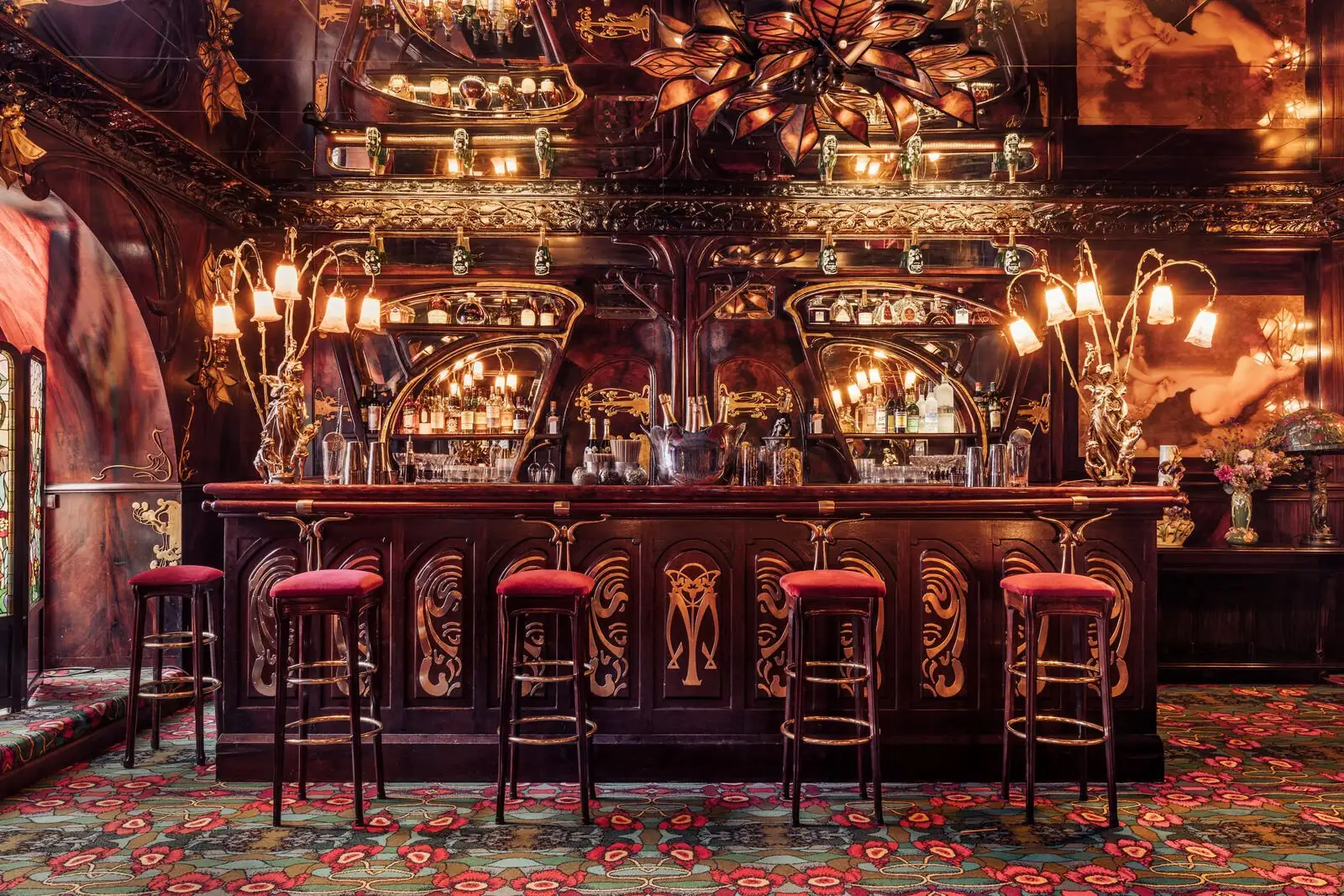 The iconic bar at Maxim's in Paris, a historic venue with Art Nouveau decor.